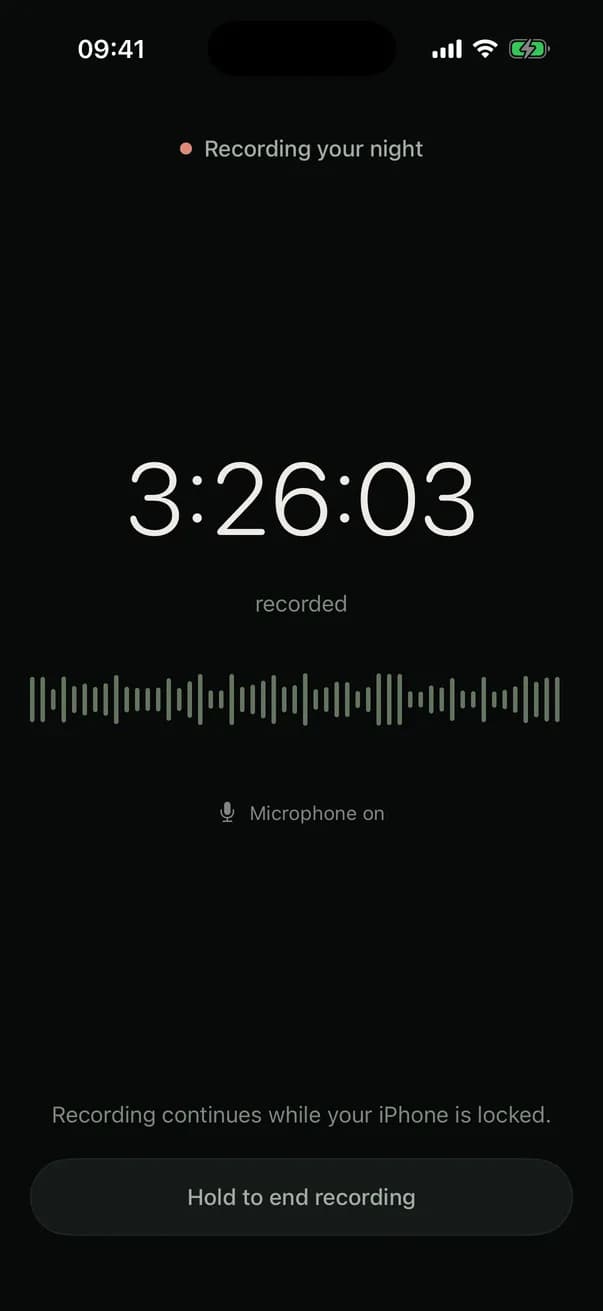 Recording in progress: elapsed time, a live waveform, microphone on, and a note that recording continues while the iPhone is locked.